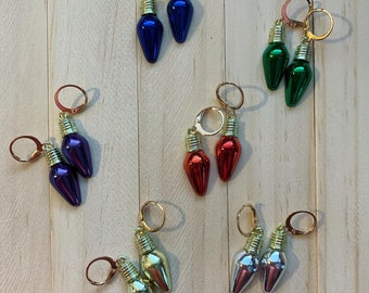 Boucles d'oreilles de lumière de vacances