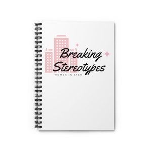 May include: A white spiral notebook with a pink city skyline graphic and the text "Breaking Stereotypes" in black. Below the text is the phrase "Women in STEM".