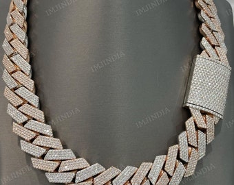 May include: A gold and rose gold chain necklace with a prong-set diamond design. The chain is thick and has a box clasp.