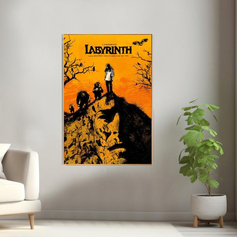 May include: A movie poster for the film Labyrinth, featuring a dark silhouette of a face against a yellow and orange background. The title "Labyrinth" is in bold, black letters. The poster also features a group of characters standing on a cliff.