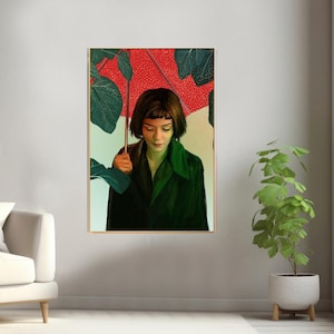 May include: A woman with short, dark hair stands under a red umbrella with green leaves. She is wearing a dark green jacket and looking down.
