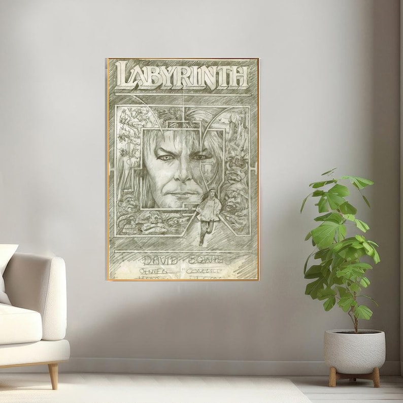 May include: A black and white pencil drawing of a movie poster for the film Labyrinth. The poster features a close-up of David Bowie's face, with a maze-like design behind him. The text "Labyrinth" is at the top of the poster, and "David Bowie" is at the bottom.