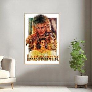 May include: A vintage-style poster for the movie Labyrinth, featuring a colorful illustration of Jareth the Goblin King and Sarah Williams. The poster has a gold frame and the title "Labyrinth" is printed in bold, gold letters.