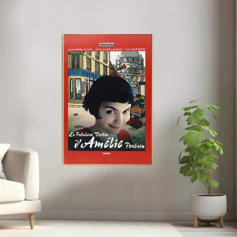 May include: A red movie poster with a cartoon image of a Parisian street scene. The poster features a woman with short black hair looking directly at the viewer. The title of the movie is "Le Fabuleux Destin d'Am&eacute;lie Poulain".