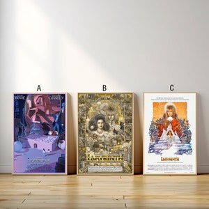 May include: Three movie posters for the film Labyrinth, featuring David Bowie as Jareth the Goblin King. The posters are in different styles, with one featuring a pink and purple color scheme, one featuring a gold and black color scheme, and one featuring a more traditional movie poster design.