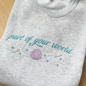 Princess Inspired Sweatshirt Embroidered with Ariel Inspired Quote and Motif - &#39;part of your world&#39;