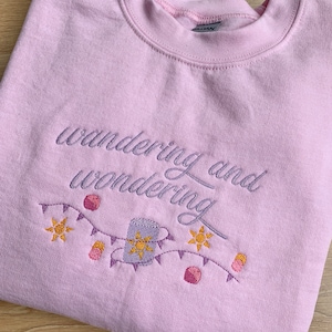 Princess Inspired Embroidered Pink Crewneck Sweatshirt with Rapunzel Inspired Quote and Motif - 'wandering and wondering'