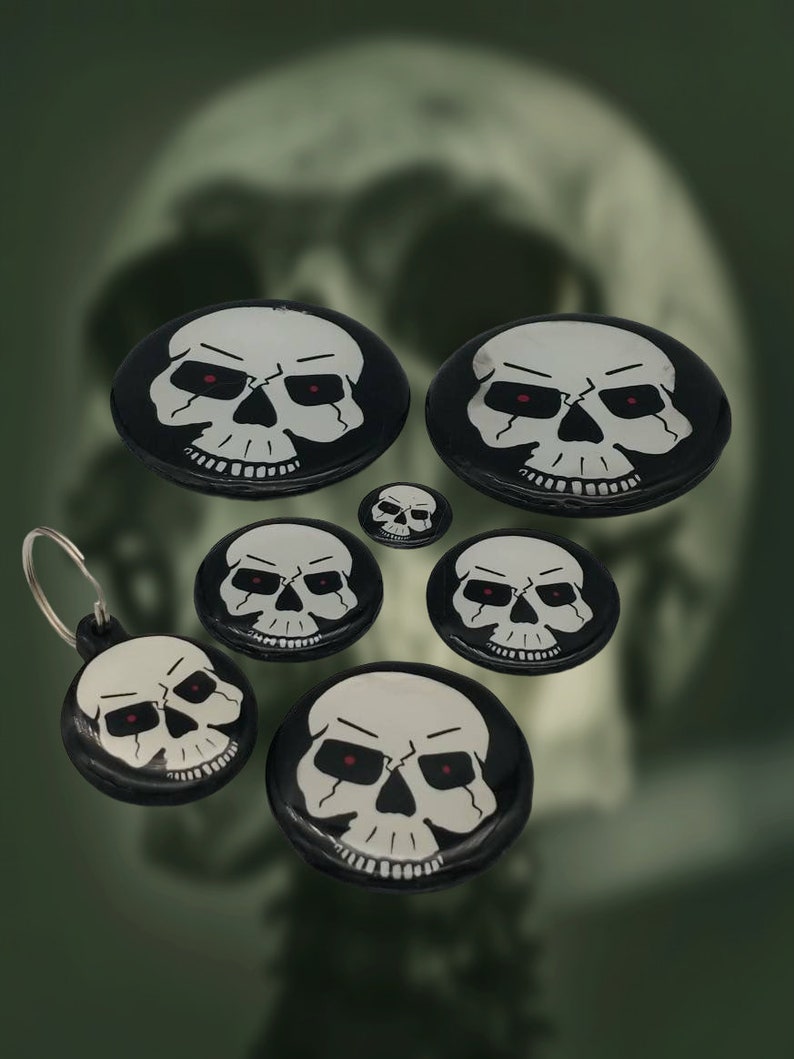 a group of skulls with red eyes on them