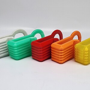 Fluorescent Green PLA+, Red PETG, Orange PETG, Clearish yellow PETG Fathooks