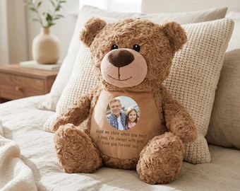 May include: A brown plush teddy bear featuring a circular photo insert on its chest showing an older man and a young girl. Below the photo, the text reads: Hold me close when you need a hug. I'm always with you! Love you Forever xxx.