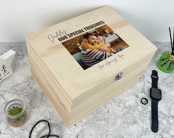 May include: A rectangular light-colored wooden keepsake box with a hinged lid featuring a printed photograph of an adult and child embracing. The text "Daddy, OUR SPECIAL TREASURES" and "Love always Ava" is printed on the lid surface.