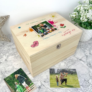 May include: A wooden keepsake box with a personalized message that reads "Our Adventures Together" and "Happy Mother's Day Love from George XX". The box has a photo of a mother and child on the lid, along with colorful drawings of a sun, flowers, butterflies, and a heart.