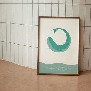 May include: A framed print with a teal blue whale illustration and the text "THE OCEAN" at the bottom.