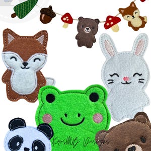 May include: A selection of felt animal and nature-themed decorations. The decorations include a fox, panda, frog, bear, and bunny. A banner with a tree, acorn, mushrooms, and a bear is also included. The text "2 SIZES" is displayed.