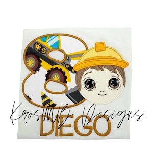 May include: A white t-shirt with a yellow number 8, a cartoon construction worker, and the name "DIEGO" embroidered in gold thread.