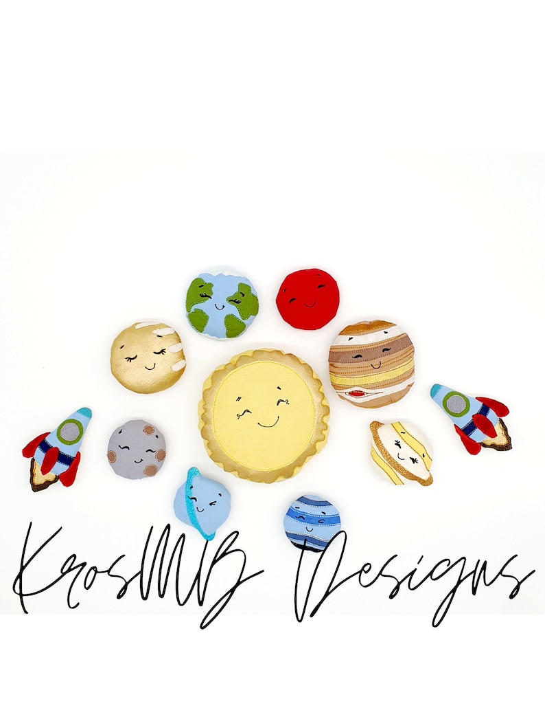 May include: A set of plush planets and a rocket ship, all with smiling faces. The planets are yellow, red, blue, brown, and gray. The rocket ship is red and blue. The planets and rocket ship are arranged in a circle on a white background. The text "KrosMB Designs" is written in black below the planets.