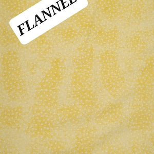 FLANNEL: Mottled Bright Yellow with Tiny White Dots Comfy FLANNEL from A. E. Nathan. Quilting/Craft/Apparel/Home Decor.