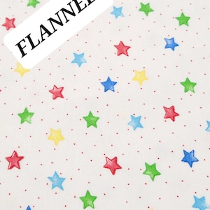 Comfy  Cotton FLANNEL. White with Small Multi-colored Stars and Tiny Red Polka Dots from A. E. Nathan. Quilting/Craft/Kids/Apparel FLANNEL,