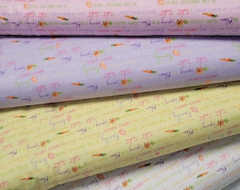 May include: Four rolls of fabric with a repeating pattern of carrots, flowers, and the text "Happy Easter" and "Family is the sweetest treat". The fabric is in shades of pink, purple, yellow, and white.