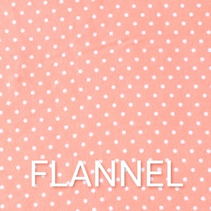 May include: A close-up of a coral-colored flannel fabric with a white polka dot pattern. The word "FLANNEL" is spelled out in white block letters across the bottom of the image. This fabric is suitable for various sewing projects.