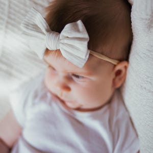 Lucy Sophia &quot;Eliza&quot; Headband in White- Infant headband, baby headband, knit bow, tan nylon headband, boutique, toddler headband,