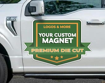 May include: A white truck with a green and orange custom magnet on the side door. The magnet says "Logos & More", "Your Custom Magnet", and "Premium Die Cut".