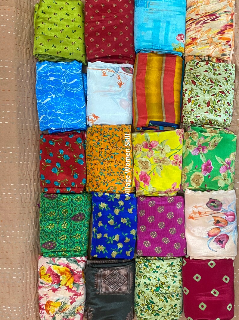 May include: A collection of 20 colorful fabric squares with various patterns, including floral, geometric, and abstract designs. The fabric squares are arranged in four rows of five squares each. The text "Village Women Skill" is visible on the right side of the image.