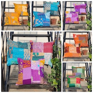 May include: A collection of colourful patchwork cushion covers with various patterns and designs. The cushion covers are made from recycled saris and are perfect for adding a touch of bohemian style to your home decor.