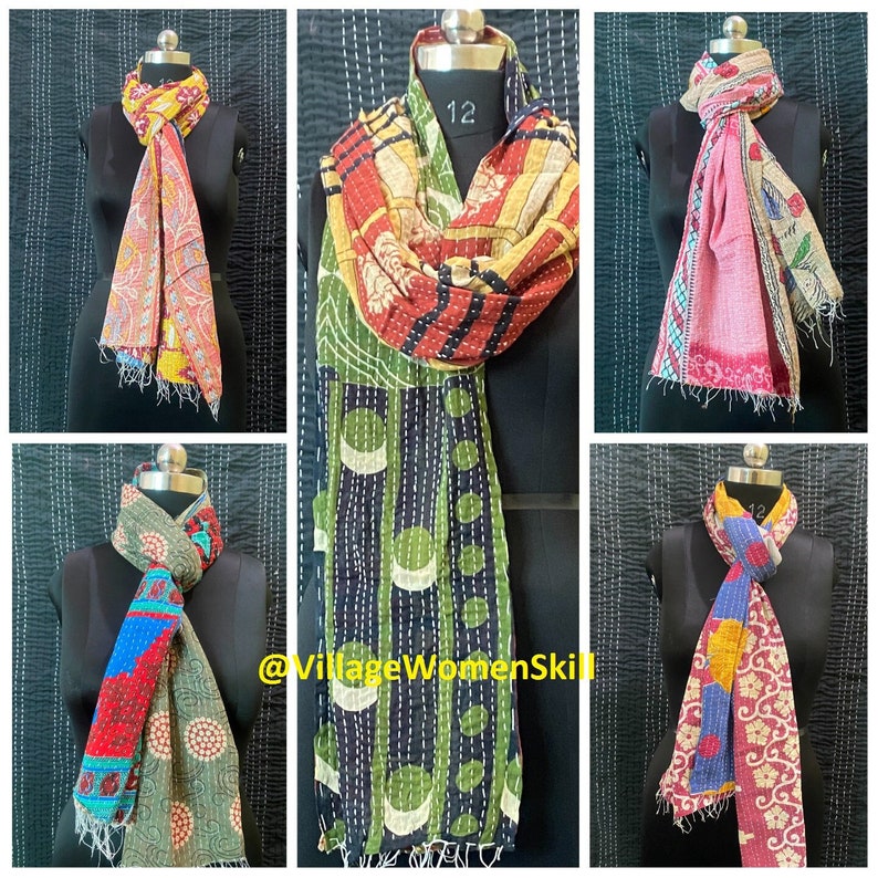 May include: Six colorful kantha scarves with different patterns and colors, including red, blue, green, yellow, and pink. The scarves are made of recycled saris and are hand-stitched. The scarves are displayed on mannequins with the text "@VillageWomenSkill" at the bottom.
