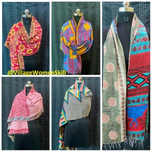 May include: Five colorful kantha quilts, each with a unique pattern and color scheme. The quilts are made of recycled saris and are perfect for adding a touch of bohemian style to any home.