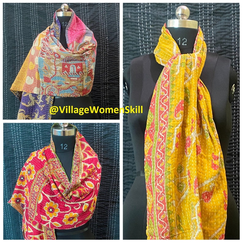 May include: Three kantha stitch scarves in different colors and patterns. The scarves are made of cotton and are hand-stitched. The scarves are displayed on mannequins. The scarves are all approximately 12 inches wide.