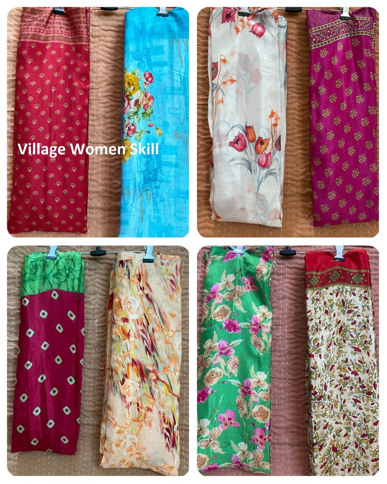 May include: Six different colorful scarves with floral patterns. The scarves are hanging on a clothesline. The text "Village Women Skill" is visible on the top left scarf.
