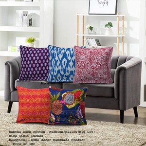 May include: Four colorful kantha work cotton cushion covers with different patterns. The covers are 16 inches by 16 inches and are handmade. The covers are displayed on a gray couch.