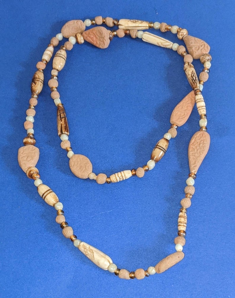 Vintage hand carved clay and bone beaded necklace.