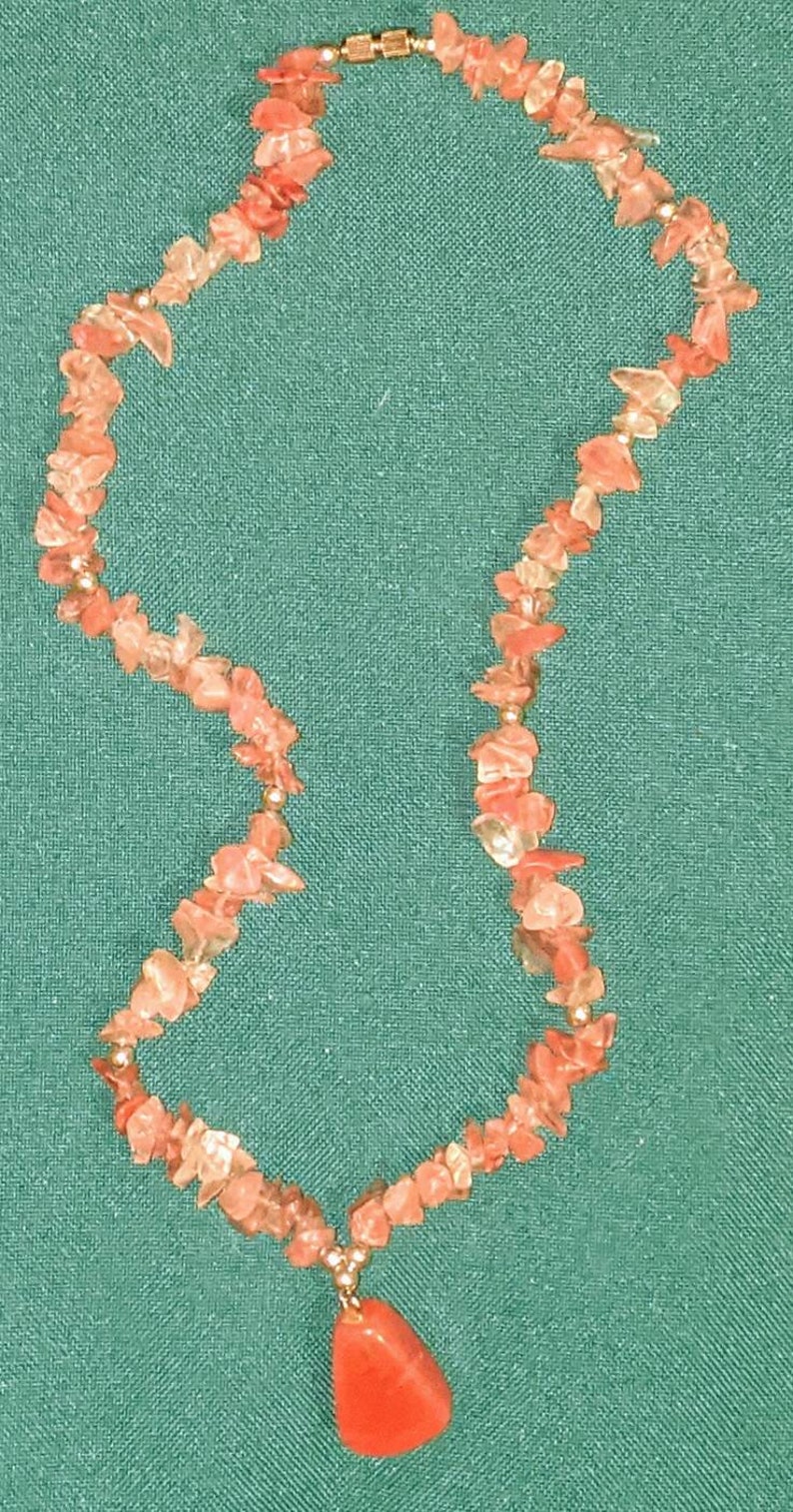 Vintage polished Rose Quartz necklace with pendant.
