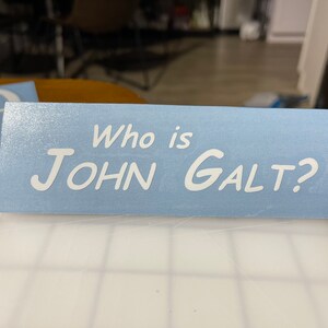 Ship from USA -  movies_who_is_jonh_galt  Decal Sticker For Use On Laptop, Helmet, Car, Truck, Motorcycle, Windows, Bumper, Wall