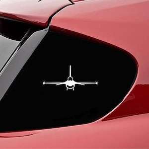 May include: White silhouette of a fighter jet on a black background. The jet is facing forward with its wings spread out.