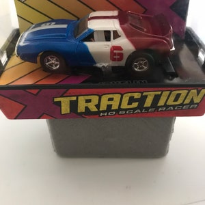 Afx HO scale Slotcar 1971 amx Javelin #6 red-white and blue trans American racing colors.