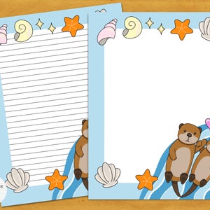 May include: Blue and white lined stationery paper with a sea otter theme. The paper features two otters swimming in a blue wave with seashells, starfish, and a pink heart. The text "Heritage Paper Design" is in the bottom left corner.