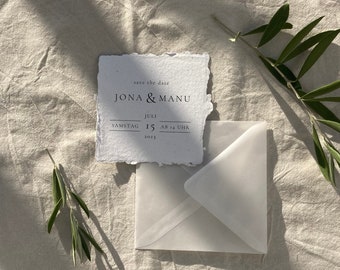 SAMPLE sustainable save the date card made of handmade paper in a minimalist design with an envelope made of transparent paper