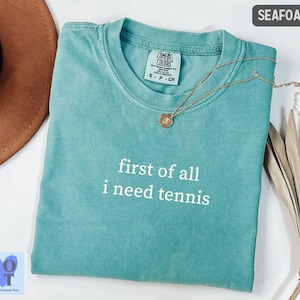 Comfort Colors First Of All I Need Tennis TShirt, Funny Tennis Player Tee, Sporty Graphic Shirt, Casual Tennis Court Style Tee