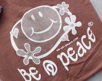 Graphic Tee Festival Clothing | Cartoon Smiley Face Shirt | Retro Hippie Unisex T-Shirt |  Chocolate Brown