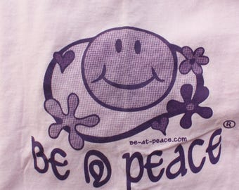 Graphic Tee Festival Clothing | Cartoon Smiley Face Shirt | Retro Hippie Unisex T-Shirt | Light Pink