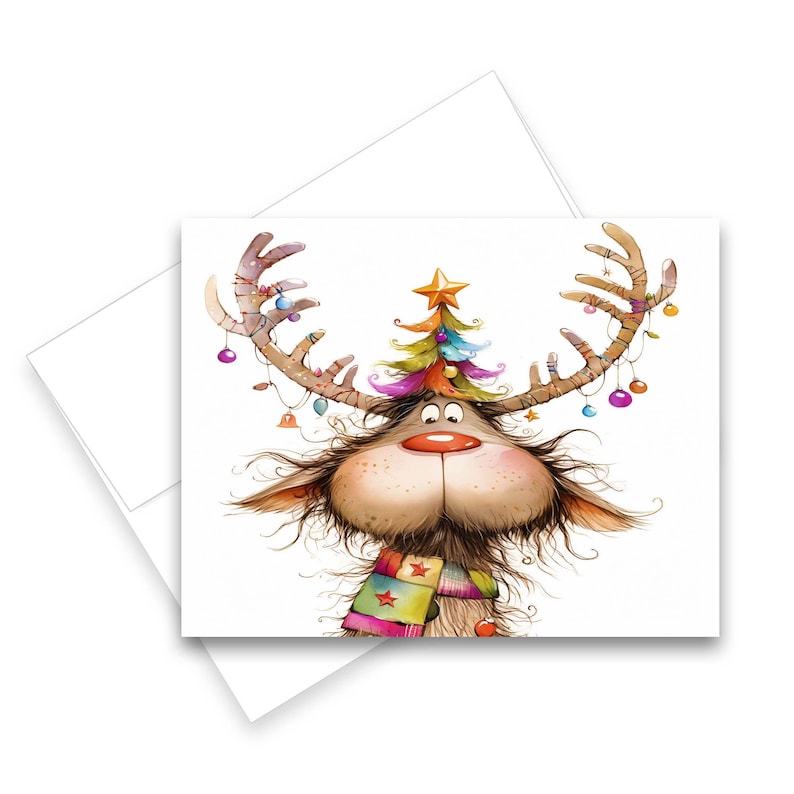 May include: A whimsical Christmas card featuring a cartoon reindeer with large antlers adorned with ornaments and a small Christmas tree. The reindeer has a red nose, a colorful scarf, and a cheerful expression. The card is on a white background.