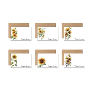 May include: Set of six blank note cards with a watercolor sunflower design and the name "Megan Jensen" printed on each card.