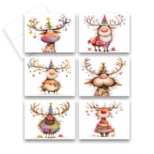 May include: Set of six Christmas cards featuring whimsical reindeer illustrations. Each card showcases a different reindeer design with festive decorations, including colorful ornaments, scarves, and Christmas tree antlers. The cards are on a white background.