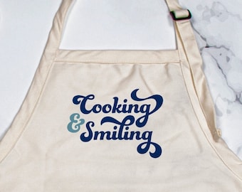 Cooking & Smiling Canvas Apron with Adjustable Strap and Pockets | Widespread Panic Lyric | Hatfield Quote