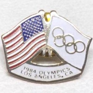 Broche antigo vintage canadense com a bandeira olímpica e americana dos EUA nos Jogos Olímpicos de Verão de Los Angeles de 1984, Califórnia. Ideal para presente de Natal ou para colocar na meia.