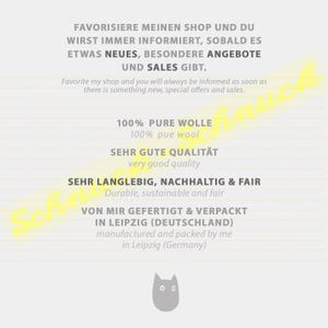 May include: A white and yellow graphic with text in German and English. The text says "Favorisiere meinen Shop und du wirst immer informiert, sobald es etwas Neues, besondere Angebote und Sales gibt." and "Favorite my shop and you will always be informed as soon as there is something new, special offers and sales." The text also says "100% Pure Wolle", "100% pue wool", "Sehr gute Qualit&auml;t", "very good quality", "Sehr langlebig, nachhaltig & fair", "Durable, sustainable and fair", "Von mir gefertigt & verpackt in Leipzig (Deutschland)", and "manufactured and packed by me in Leipzig (Germany)". There is a small grey cat illustration at the bottom.