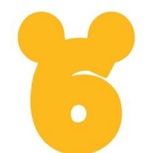 May include: A yellow number six with Mickey Mouse ears. The number is a whimsical design for a birthday party or other celebration.